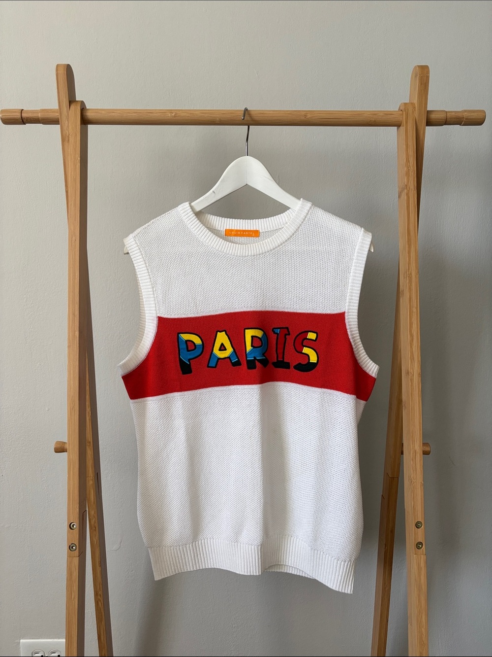 White Sleeveless Paris Knit Sweater Vest with Red Accent